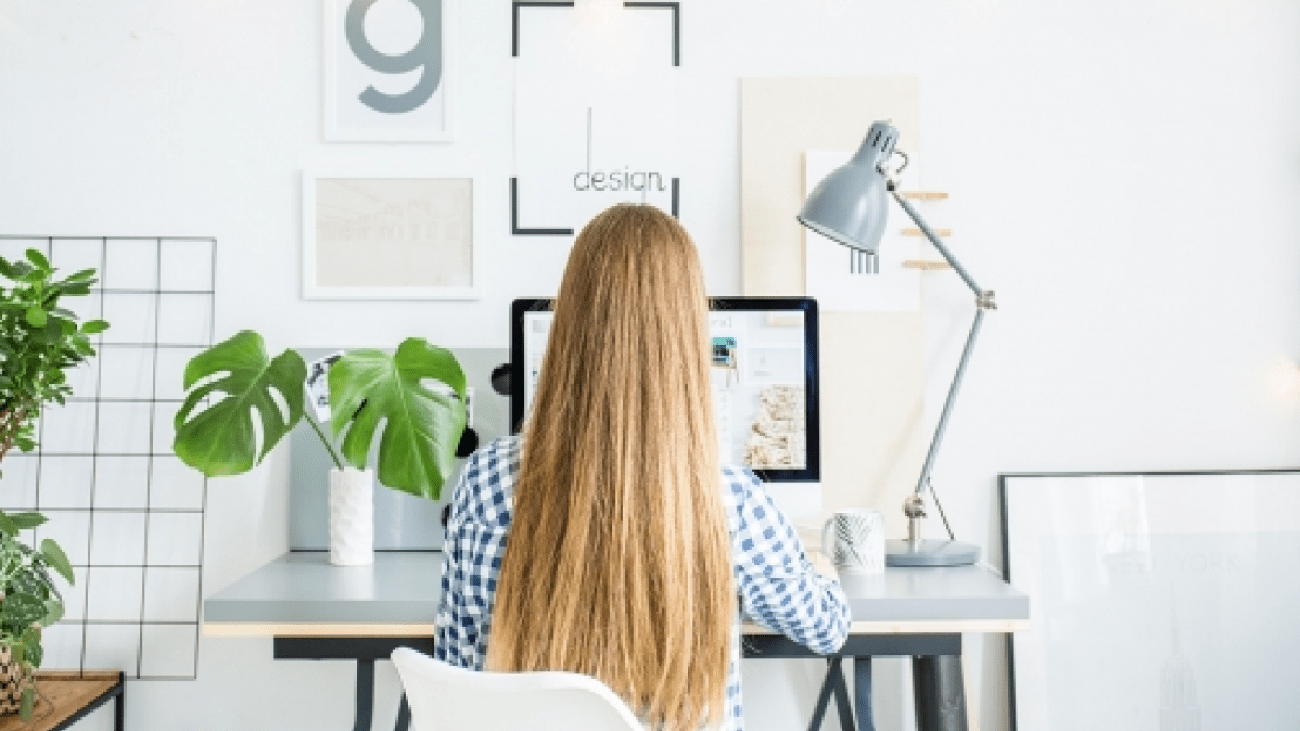 happy-lady-sitting-in-office-coworking-while-P5AFND8