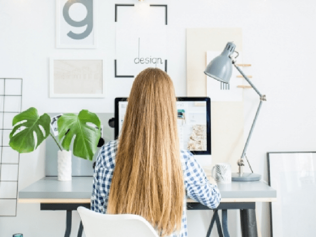 happy-lady-sitting-in-office-coworking-while-P5AFND8