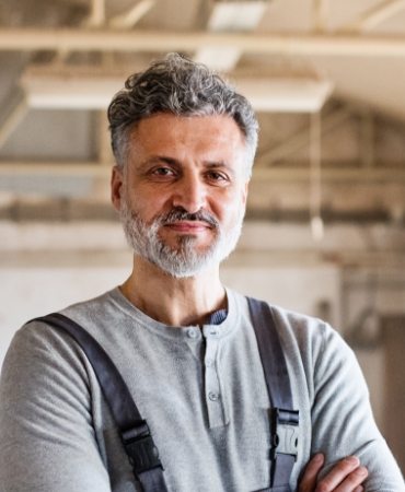portrait-of-a-man-worker-in-the-carpentry-RQKJWHY