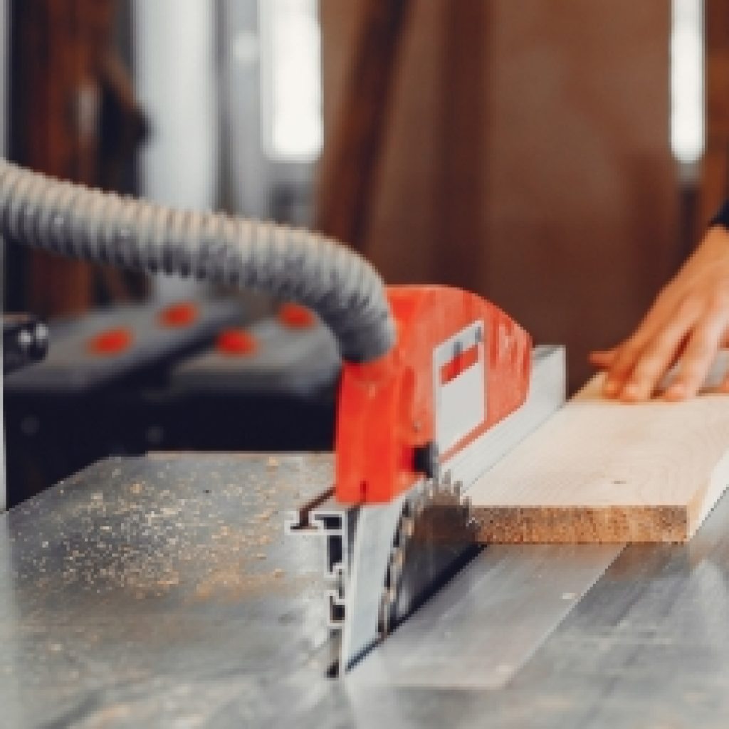 the-carpenter-works-with-a-tree-YUPRN34