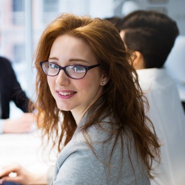 business-colleagues-at-their-workplace-in-office-R9HYAS8