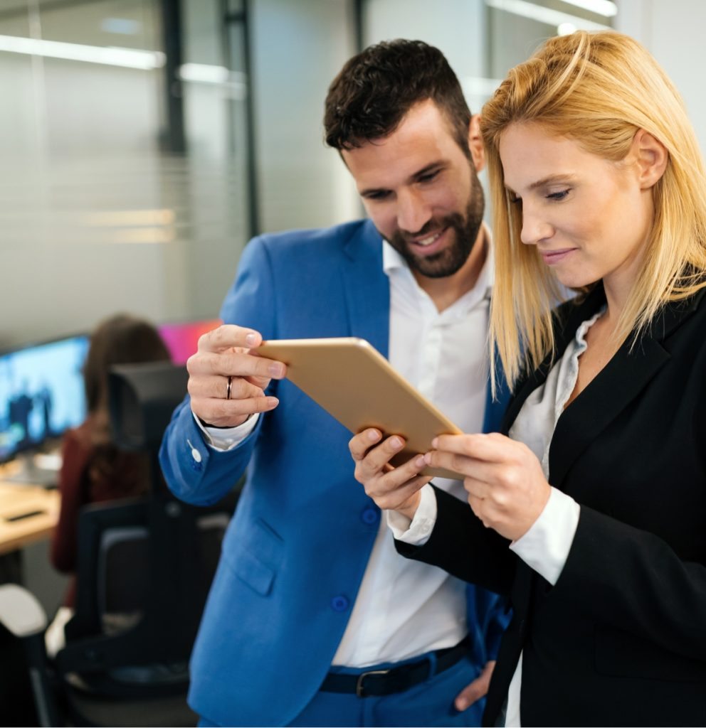 businesspeople-discussing-while-using-digital-WFGVC3X