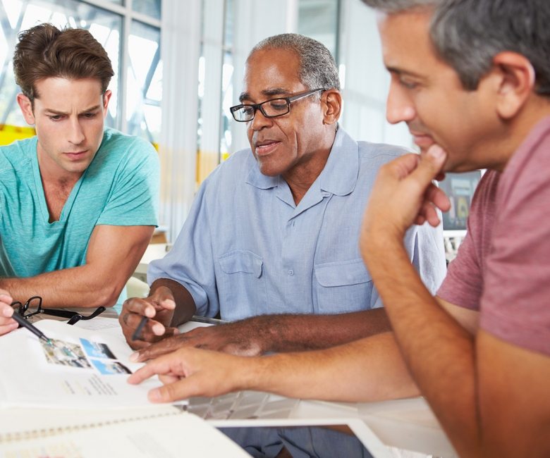 group-of-men-meeting-in-creative-office-PXEKFW4