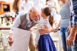 family-celebration-or-a-garden-party-outside-in-PVHU9JN