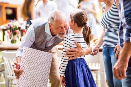 family-celebration-or-a-garden-party-outside-in-PVHU9JN