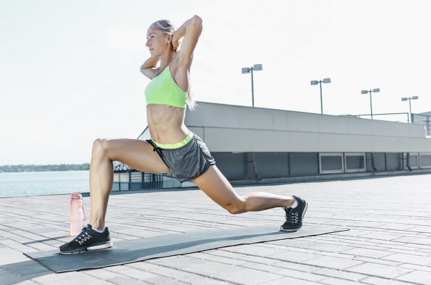 fit-fitness-woman-doing-stretching-exercises-SPE67T9