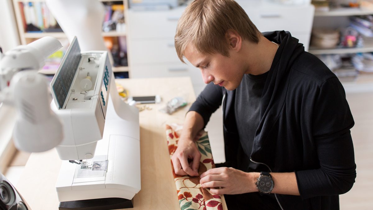 fashion-designer-with-making-dress-at-studio-P75Z6LP