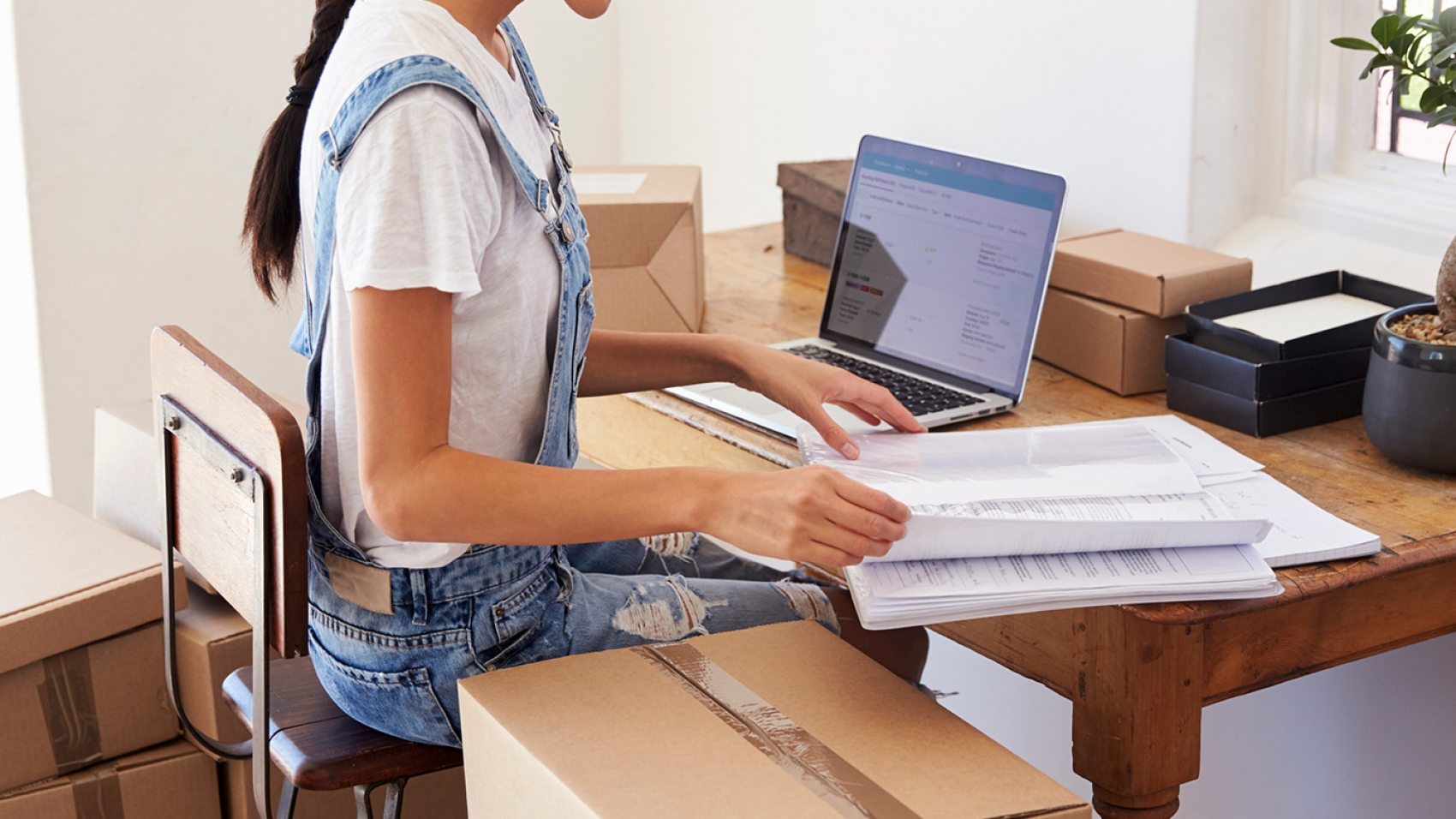 woman-running-business-from-home-working-on-PCZKTN9